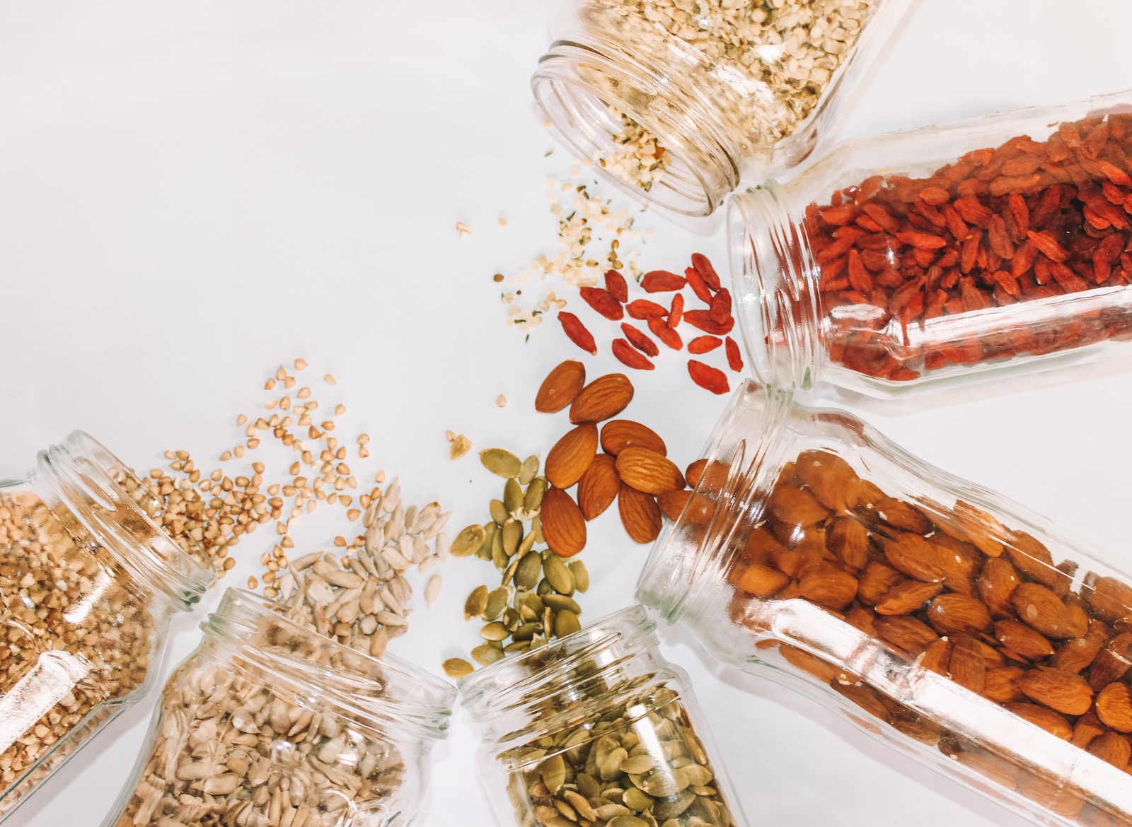 Assorted-color beans, a variety of ancient grains and superfoods, symbolizing the rich diversity and nutritional value of these ingredients.